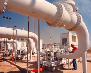 A technician at the Strategic Petroleum Reserve inspects crude oil transfer pipe