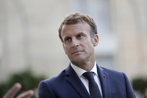 French President Emmanuel Macron listens to Dutch Prime Minister Mark Rutte during a joint press conference before their talks at the Elysee Palace Tuesday, Aug. 31, 2021 in Paris