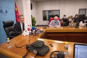 Wang Lutong, Director General of the Department of European Affairs, speaks during a news briefing at the Ministry of Foreign Affairs in Beijing, Saturday, April 2, 2022.