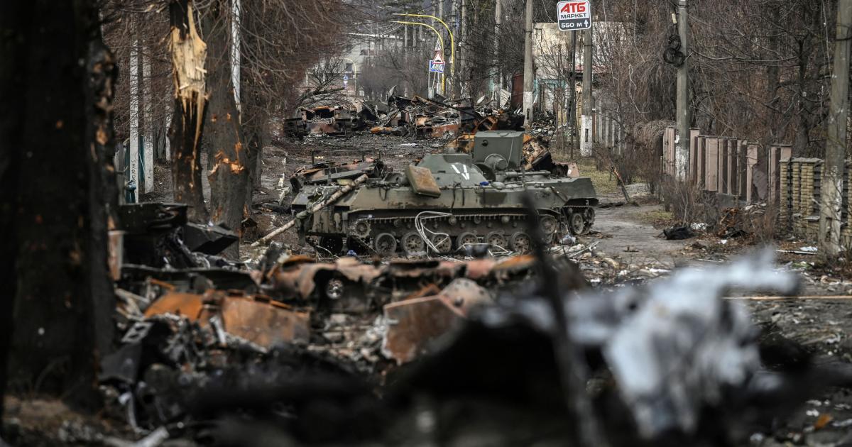 Destroyed armored vehicles on a road