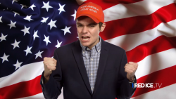 Nick Fuentes stands in front of American flag with a Trump campaign hat on