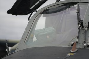 File - A military hat in seen through a window of a Russian Ka-52 helicopter gunship is seen in the field after a forced landing outside Kyiv, Ukraine, Thursday, Feb. 24, 2022.