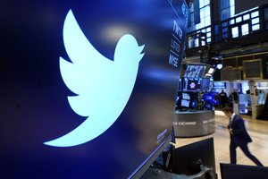 FILE - The logo for Twitter appears above a trading post on the floor of the New York Stock Exchange, Monday, Nov. 29, 2021.