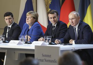 In this Dec. 9, 2019, file photo, Ukraine's President Volodymyr Zelenskiy, left, German Chancellor Angela Merkel, French President Emmanuel Macron and Russian President Vladimir Putin, right, attend a joint news conference at the Elysee Palace in Paris, France