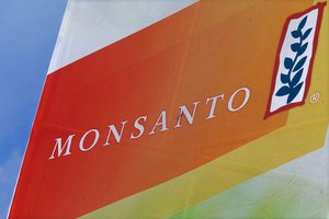 In this Monday, Aug. 31, 2015 photo, the Monsanto logo is seen at the Farm Progress Show in Decatur, Ill.