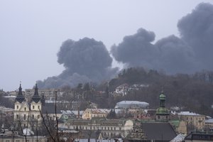 FILE - Smoke rises in the air in Lviv, western Ukraine, Saturday, March 26, 2022.