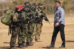 Brazilian President Jair Bolsonaro attends annual military exercises by the Navy, Army and Air Force, in Formosa, Brazil, Monday, Aug. 16, 2021.