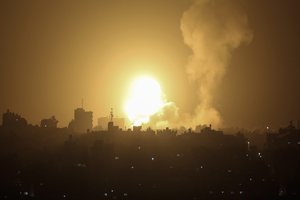 FILE - An explosion is caused by Israeli airstrikes on a Hamas military base in town of Khan Younis, southern Gaza Strip, April 19, 2022.