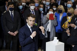 French President Emmanuel Macron speaks to representatives of the agricultural world as he visits the International Agriculture Fair, in Paris, Saturday, Feb. 26, 2022.