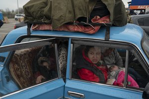 Internally displaced people from Mariupol and nearby towns arrive at a refugee center fleeing from the Russian attacks, in Zaporizhzhia, Ukraine, Thursday, April 21, 2022.