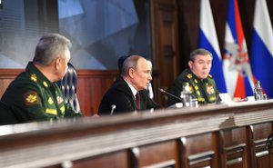 Vladimir Putin with Defence Minister Sergei Shoigu (left) and Chief of the General Staff of the Russian Armed Forces Valery Gerasimov at the expanded meeting of the Defence Ministry Board