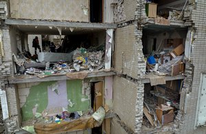 Firefighters work inside a building destroyed by a Russian bomb in Chernihiv on Friday, April 22, 2022.