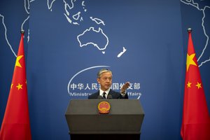 China's Ministry of Foreign Affairs spokesperson Wang Wenbin gestures during a daily briefing at the Ministry of Foreign Affairs in Beijing, Friday, July 24, 2020