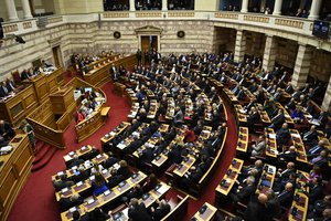 Members of the Greek parliament debate the Prespa Agreement in Athens, Friday, Jan. 25, 2019.