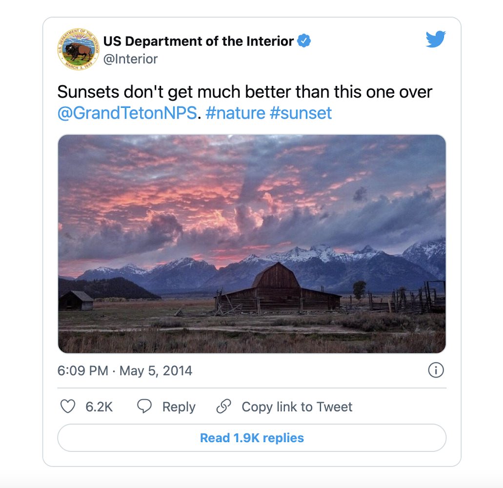 A screenshot of an embedded Tweet with less accessible link colors. The embedded Tweet shows light blue text, and has the text “Sunsets don't get much better than this one over @GrandTetonNPS. #nature #sunset” from the Twitter user @interior with the scree name US Department of the Interior.