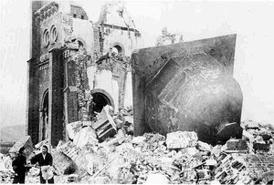 File - Urakami Tenshudo (Catholic Church in Nagasaki) destroyed by the atomic bombing, 9 August 1945, Japan. The belltower of the church was blown off and is seen on the right.