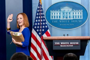 White House press secretary Jen Psaki waves goodbye at her last press briefing at the White House in Washington, Friday, May 13, 2022.