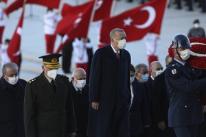 Turkey's President Recep Tayyip Erdogan, center, walks with other Turkish leaders to visit the mausoleum of modern Turkey's founder, Mustafa Kemal Ataturk, during a memorial ceremony at his mausoleum on the 83th anniversary of his death, in Ankara, Turkey, Wednesday, Nov. 10, 2021