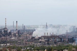 Smoke rises from the Metallurgical Combine Azovstal in Mariupol, in territory under the government of the Donetsk People's Republic, eastern in Mariupol, Ukraine, Thursday, May 5, 2022.