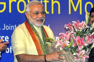 Chief Minister of Gujarat Narendra Modi during a program organised by business chambers ICC, BCC and MCCI on April 9, 2013 in Kolkata, India. Modi, widely seen as the Prime Ministerial candidate of BJP in the next general elections, appeared to be reaching out to Trinamool Congress which can be a prospective NDA ally after it walked out of the UPA government