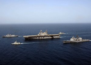 The amphibious assault ship USS Nassau (LHA 4) leads a formation of the coalition ships including the guided missile cruiser USS Philippine Sea (CG 58), the Bahraini Navy frigate RBNS Al Manama (FPBGH 50), the Royal New Zealand Navy frigate HMNZS Te Mana (F 111), and the United Arab Emirates Navy missile boat UAENS Mubarraz (P4401) during Exercise Goalkeeper III in the Persian Gulf. The multi-lateral Goalkeeper III exercise includes participation from Bahrain, New Zealand, United Arab Emirates, Qatar, Great Britain and the U.S. The exercise is designed to train forces in various aspects of maritime security operations as well as command and control functions with the Royal Bahraini naval staff. MSO help develop security in the maritime environment, which promotes stability and global prosperity.