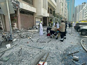 In this photo released by the Abu Dhabi Police, debris covers the street after an explosion in the Khalidiya district of Abu Dhabi, United Arab Emirates, Monday, May 23, 2022.