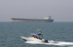 In this July 2, 2012 file photo, an Iranian Revolutionary Guard speedboat moves in the Persian Gulf near an oil tanker. On Monday, April 8, 2019