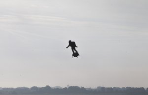 Franky Zapata, a 40-year-old inventor,  takes to the air in Sangatte, Northern France, at the start of his attempt to cross the channel from France to England, aboard his flyboard, Sunday Aug. 4, 2019.