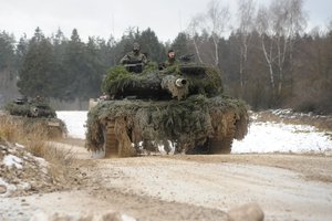 German Bundeswehr soldiers drive Leopard 2 tanks on the Grafenwoehr Training Area tank trails