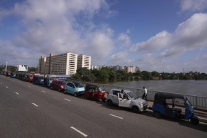 Motorists queue up outside a fuel station to buy gasoline in Colombo, Sri Lanka, Friday, May 20, 2022.