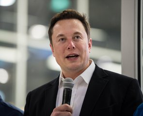 SpaceX Chief Engineer Elon Musk answers a question from the press in front of the Crew Dragon that is being prepared for the Demo-2 mission, at SpaceX Headquarters, Thursday, Oct. 10, 2019 in Hawthorne, CA.