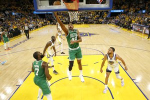 Boston Celtics center Al Horford (42) shoots against the Golden State Warriors during the second half of Game 1 of basketball's NBA Finals in San Francisco, Thursday, June 2, 2022