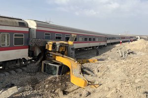 This photo provided by Iranian Red Crescent Society, shows the scene where a passenger train partially derailed near the desert city of Tabas in eastern Iran, Wednesday, Iran, Wednesday, June 8, 2022.