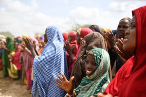 Residents of Daifa at a ceremony to hand over sixteen shallow wells with hand pumps to the local community, Somalia