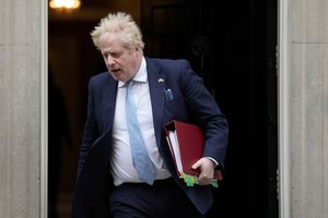 Britain's Prime Minister Boris Johnson leaves 10 Downing Street to attend the weekly Prime Ministers' Questions session in parliament in London, Wednesday, March 30, 2022