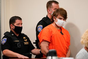 Payton Gendron is led into the courtroom for a hearing at Erie County Court, in Buffalo, N.Y., Thursday, May 19, 2022. Gendron faces charges in the May 14, fatal shooting at a supermarket.