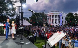 President Joe Biden and First Lady Jill Biden deliver remarks to guests attending the Fourth of July celebration on the South Lawn of the White House, Sunday, July 4, 2021