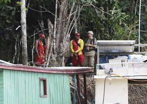 Firefighters gather at a camp set up by Indigenous people to search for Indigenous expert Bruno Pereira and freelance British journalist Dom Phillips in Atalaia do Norte, Amazonas state, Brazil, Tuesday, June 14, 2022.