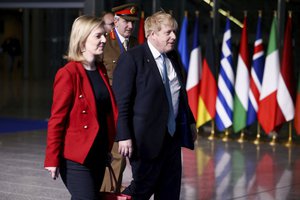 British Prime Minister Boris Johnson, Foreign Secretary Liz Truss and military representative to NATO Ben Bathurst leave NATO Headquarters following a summit on Russia's invasion of Ukraine in Brussels, Belgium, Thursday March 24, 2022