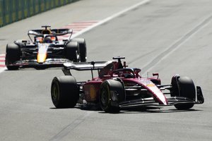 Ferrari driver Charles Leclerc of Monaco leads Red Bull driver Max Verstappen of the Netherlands during the Azerbaijan Formula One Grand Prix at the Baku circuit, in Baku, Azerbaijan, Sunday, June 12, 2022