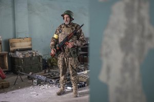 A Ukrainian soldier on a position during heavy fighting in the front line in Severodonetsk, Luhansk region, Ukraine, Wednesday, June 8, 2022