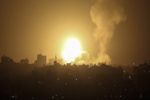 An explosion is caused by Israeli airstrikes on a Hamas military base in town of Khan Younis, southern Gaza Strip, Tuesday April 19, 2022