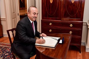 Mevlut Cavusoglu signs U.S. Secretary of State Mike Pompeo's guestbook