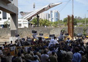 Congress party workers protest against against a new short-term government recruitment scheme for the military, in Mumbai, India, Saturday, June 18, 2022.