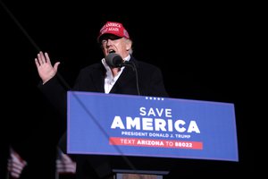 File - Former President of the United States Donald Trump speaking with supporters at a "Save America" rally at Country Thunder Arizona in Florence, Arizona.