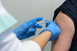 A medical worker getting vaccinated against COVID-19, Bulgaria