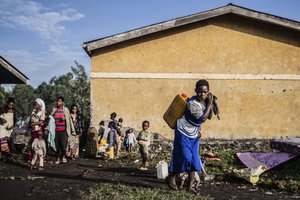 People displaced by fighting between Congolese forces and M23 rebels gather north of Goma, Democratic Republic of Congo, Friday May 27, 2022.