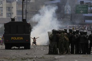 Protesters clash with police during demonstrations against the government of President Guillermo Lasso and rising fuel prices in Quito, Ecuador, Tuesday, June 21, 2022.