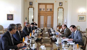 In this photo released by the Iranian Foreign Ministry, Enrique Mora, a leading European Union diplomat, second right, attends a meeting with Iran's top nuclear negotiator Ali Bagheri Kani, third left, in Tehran, Iran, Sunday, March 27, 2022.