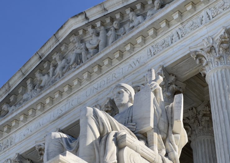 Photo of a close-up of the Supreme Court building with the words equal justice under law etched along the top